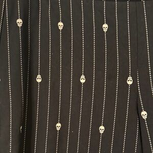 Torrid Black Pinstripe leggings with Skull Accents